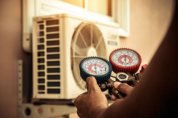 Professional Ductwork Repair technician working in Holladay, TN